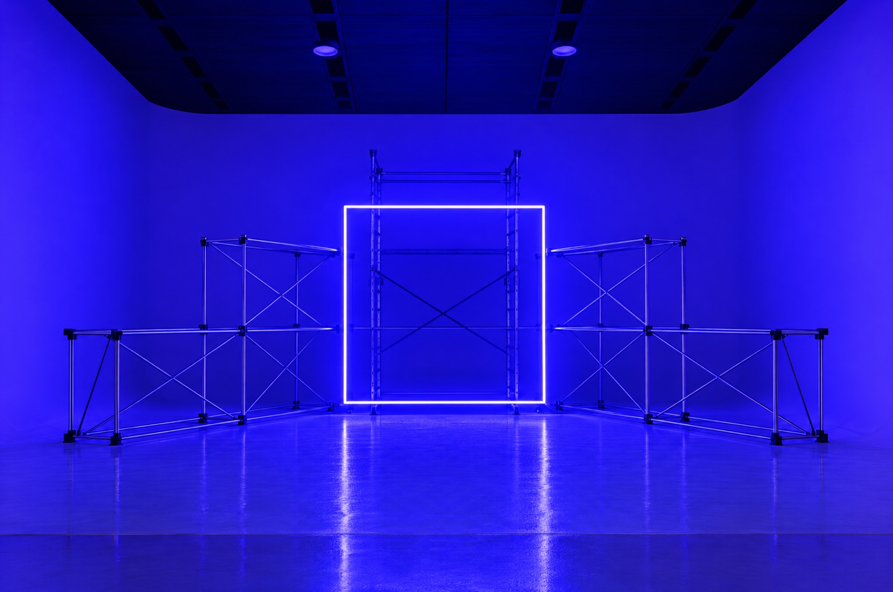 A set with a neon square and truss
