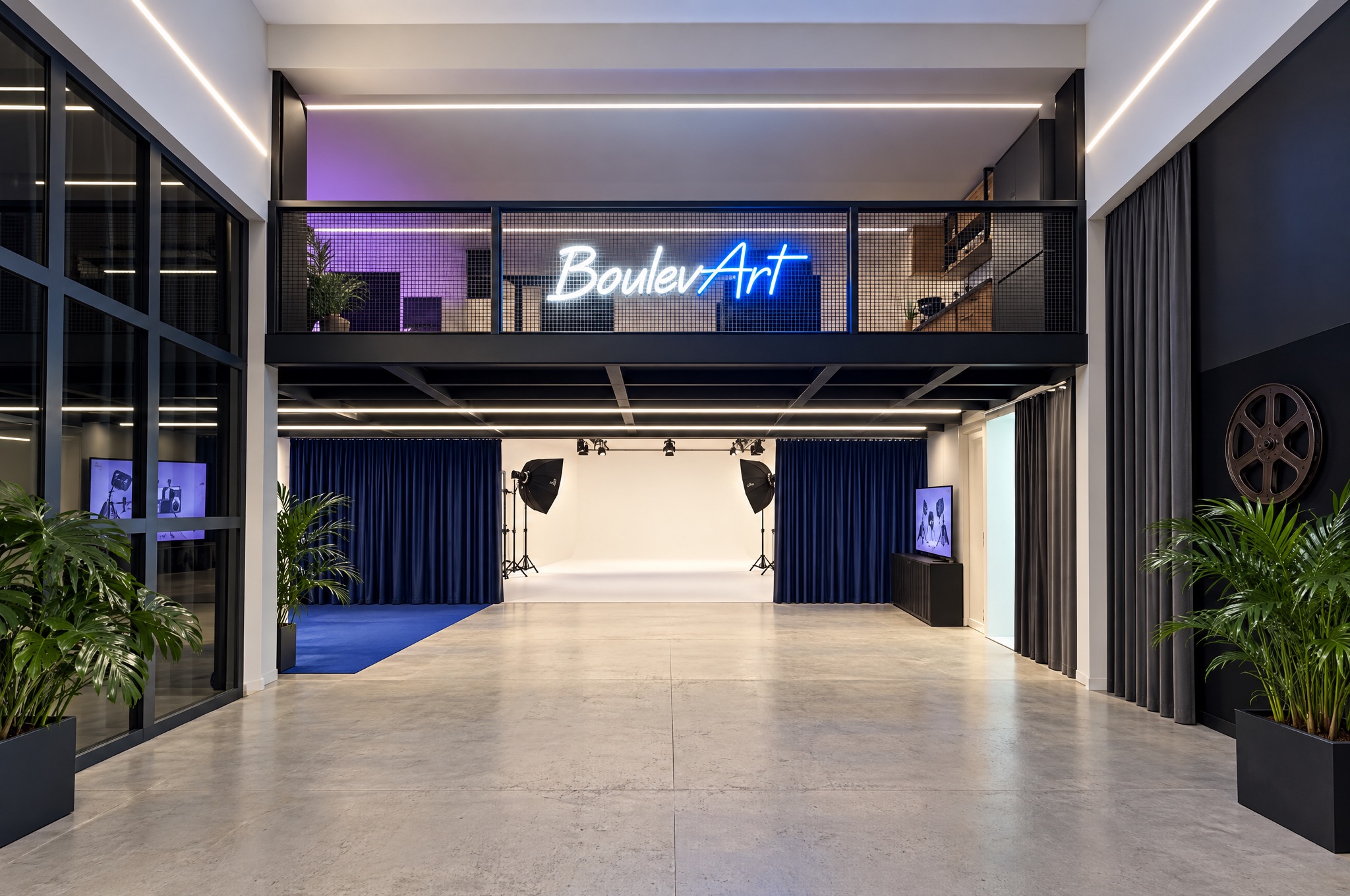 The studio lobby with its mezzanine and the BoulevArt neon sign